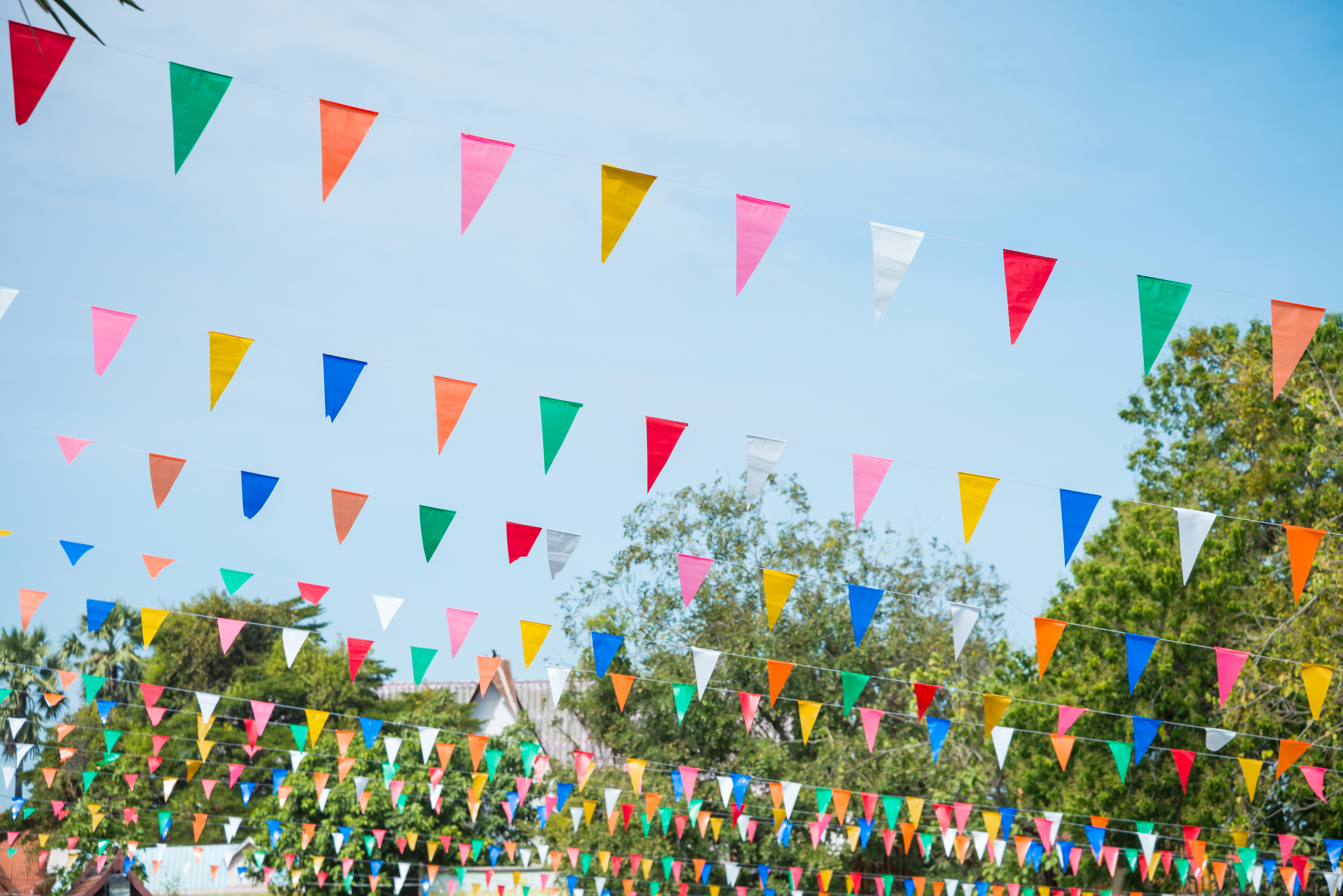 Colorful bunting decoration in outdoor summer festival party. Vintage festival and celebration concept. Colorful bunting decoration in outdoor summer festival party. Vintage festival and celebration concept.