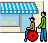 Eine Person schiebt eine andere im Rollstuhl vor einem Geschäft