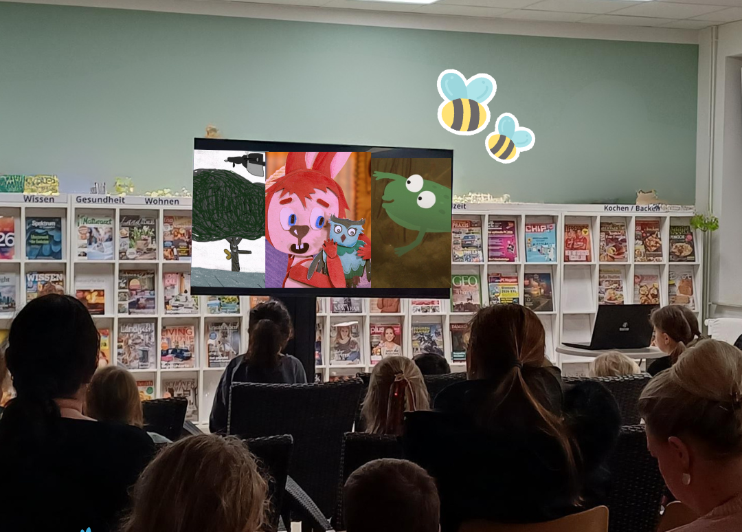 Kinder schauen einen Film in der Stadtbibliothek