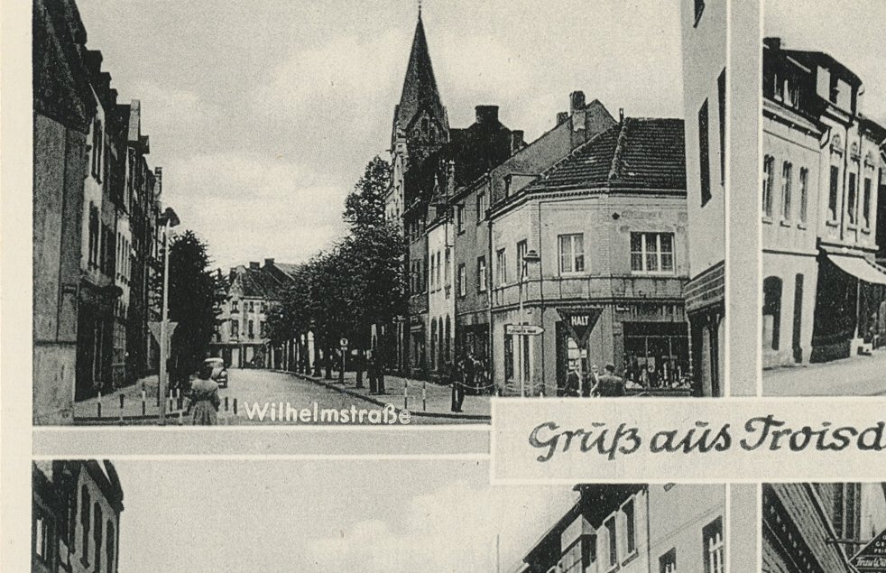 Die Wilhelmstraße auf einer historischen Ansichtskarte, Verlag F. Vogel in Oberlar (Quelle: Stadtarchiv Troisdorf) Die Wilhelmstraße auf einer historischen Ansichtskarte, Verlag F. Vogel in Oberlar (Quelle: Stadtarchiv Troisdorf)